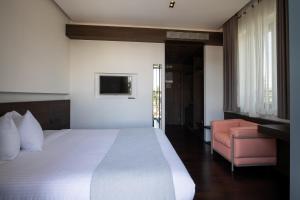 Postel nebo postele na pokoji v ubytování Domotel Kastri