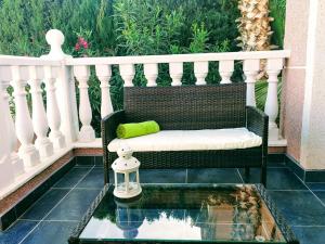 a balcony with a bench and a glass table at Casa de Limón in Ciudad Quesada +52 photos