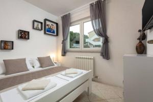 Posteľ alebo postele v izbe v ubytovaní Villa Lipovac Trogir + 33 fotografií