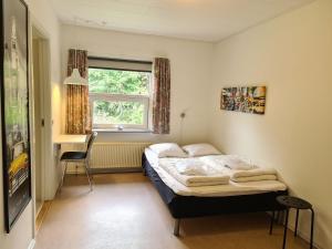 Ліжко або ліжка в номері Aarhus Hostel og Hotel