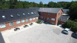 an aerial view of a building with a parking lot at Aarhus Hostel og Hotel in Aarhus