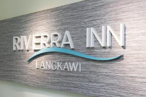 Un certificado, premio, letrero u otro documento en Riverra Inn Langkawi