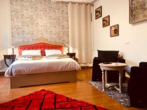 Postel nebo postele na pokoji v ubytování Hotel Le Griffon