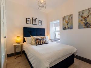 Postel nebo postele na pokoji v ubytování Macs Townhouse Dungarvan