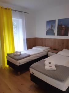 Łóżko lub łóżka w pokoju w obiekcie SZWEDZKA22 PL Premium Rooms