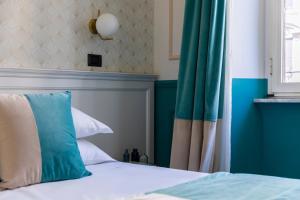 Postel nebo postele na pokoji v ubytování Hotel Coppede'