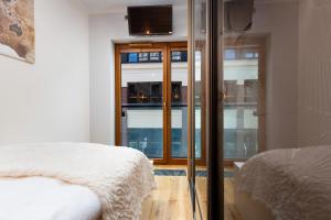 Posteľ alebo postele v izbe v ubytovaní Apartments Warsaw Pawia by Noclegi Renters