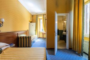 Postel nebo postele na pokoji v ubytování Hotel Coppede'