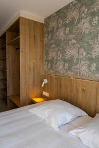 Postel nebo postele na pokoji v ubytování Hotel De Zes Bochten