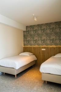 Postel nebo postele na pokoji v ubytování Hotel De Zes Bochten