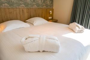 Postel nebo postele na pokoji v ubytování Hotel De Zes Bochten