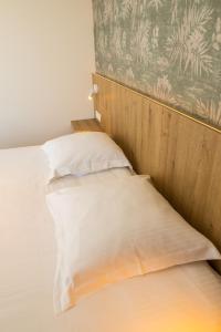 Postel nebo postele na pokoji v ubytování Hotel De Zes Bochten