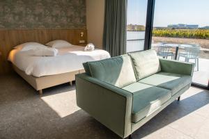 Postel nebo postele na pokoji v ubytování Hotel De Zes Bochten