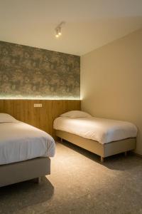 Postel nebo postele na pokoji v ubytování Hotel De Zes Bochten