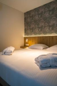 Postel nebo postele na pokoji v ubytování Hotel De Zes Bochten