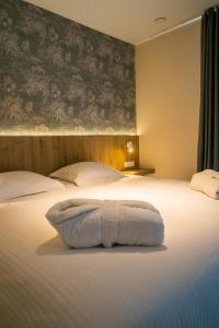 Postel nebo postele na pokoji v ubytování Hotel De Zes Bochten