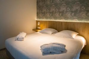Postel nebo postele na pokoji v ubytování Hotel De Zes Bochten