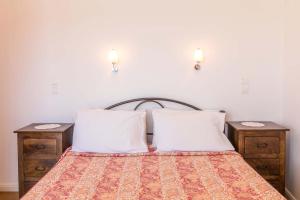 A bed or beds in a room at Lakka Seaview Apartments by Konnect