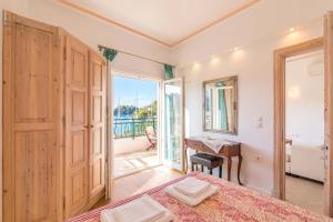 A bed or beds in a room at Lakka Seaview Apartments by Konnect