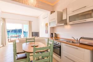 A kitchen or kitchenette at Lakka Seaview Apartments by Konnect
