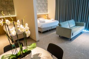 Postel nebo postele na pokoji v ubytování Hotel De Zes Bochten