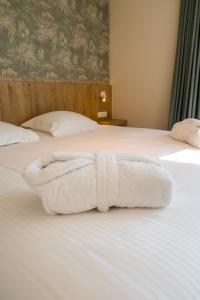 Postel nebo postele na pokoji v ubytování Hotel De Zes Bochten