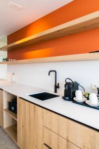 Kuchyň nebo kuchyňský kout v ubytování Hotel De Zes Bochten