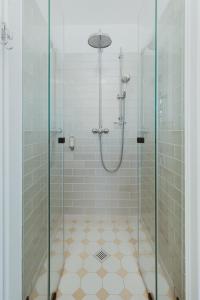 a bathroom with a shower with a glass door at Burg Reichenstein in Trechtingshausen