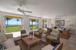 a living room with a couch and chairs and a table at Tortuga Bay in Punta Cana