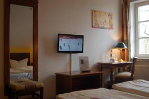 Postel nebo postele na pokoji v ubytování Hotel Königin Olga