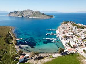 an aerial view of a small island in the ocean at Perdika Mare Guesthouse in Perdika