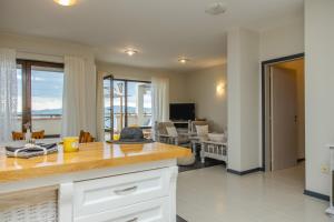 a kitchen and living room with a view of the ocean at Lovely 3BD flat with PARKING and SEA VIEW by Flаt Manаger in Chernomorets