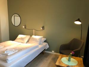 Postel nebo postele na pokoji v ubytování Ami Hotel