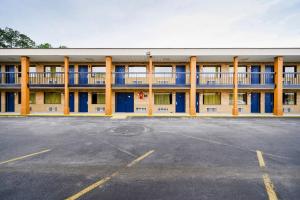 an empty parking lot in front of a building at OYO Hotel Williamston in Williamston