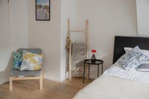 Ein Bett oder Betten in einem Zimmer der Unterkunft Madrid Suites