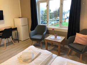 Postel nebo postele na pokoji v ubytování Ami Hotel