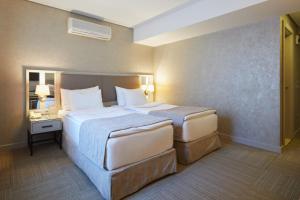 Cama o camas de una habitación en Polatdemir Hotel