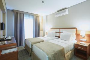 Ein Bett oder Betten in einem Zimmer der Unterkunft Polatdemir Hotel