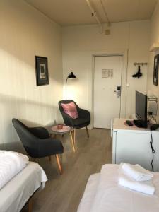 TV a/nebo společenská místnost v ubytování Ami Hotel
