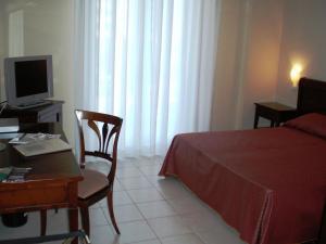 Ένα ή περισσότερα κρεβάτια σε δωμάτιο στο Hotel Park Siracusa Sicily