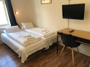 Un pat sau paturi într-o cameră la Ami Hotel