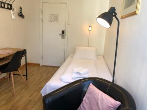 Postel nebo postele na pokoji v ubytování Ami Hotel