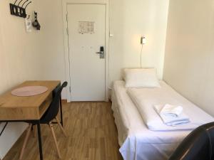 Postel nebo postele na pokoji v ubytování Ami Hotel