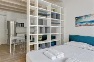 Posteľ alebo postele v izbe v ubytovaní Loft Moderno sui Navigli