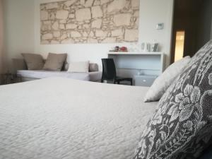 Postel nebo postele na pokoji v ubytování I Santi Coronati
