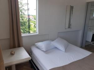 Postel nebo postele na pokoji v ubytování Pousada Encantadas