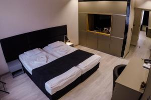 Posteľ alebo postele v izbe v ubytovaní Sóház Panzió és Apartmanház