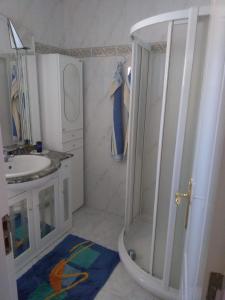 a bathroom with a shower and a sink at La Sabina in Mogán