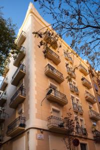 a tall building with balconies on the side of it at Casa Codina in Barcelona