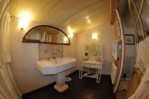 a bathroom with a sink and a mirror at Le Corps de Garde in Saint-Martin-de-Ré +35 photos